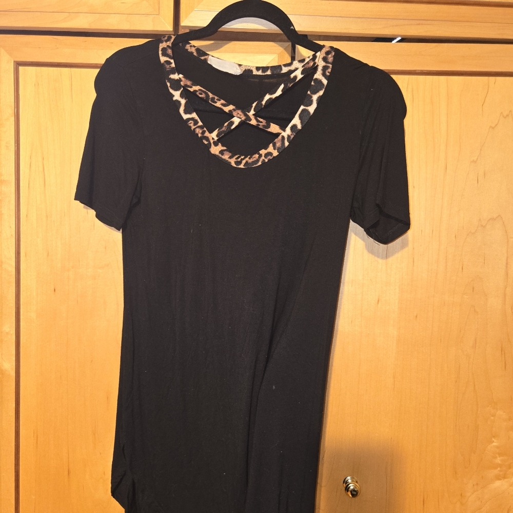 Short sleeve black shirt criss cross neckline detail